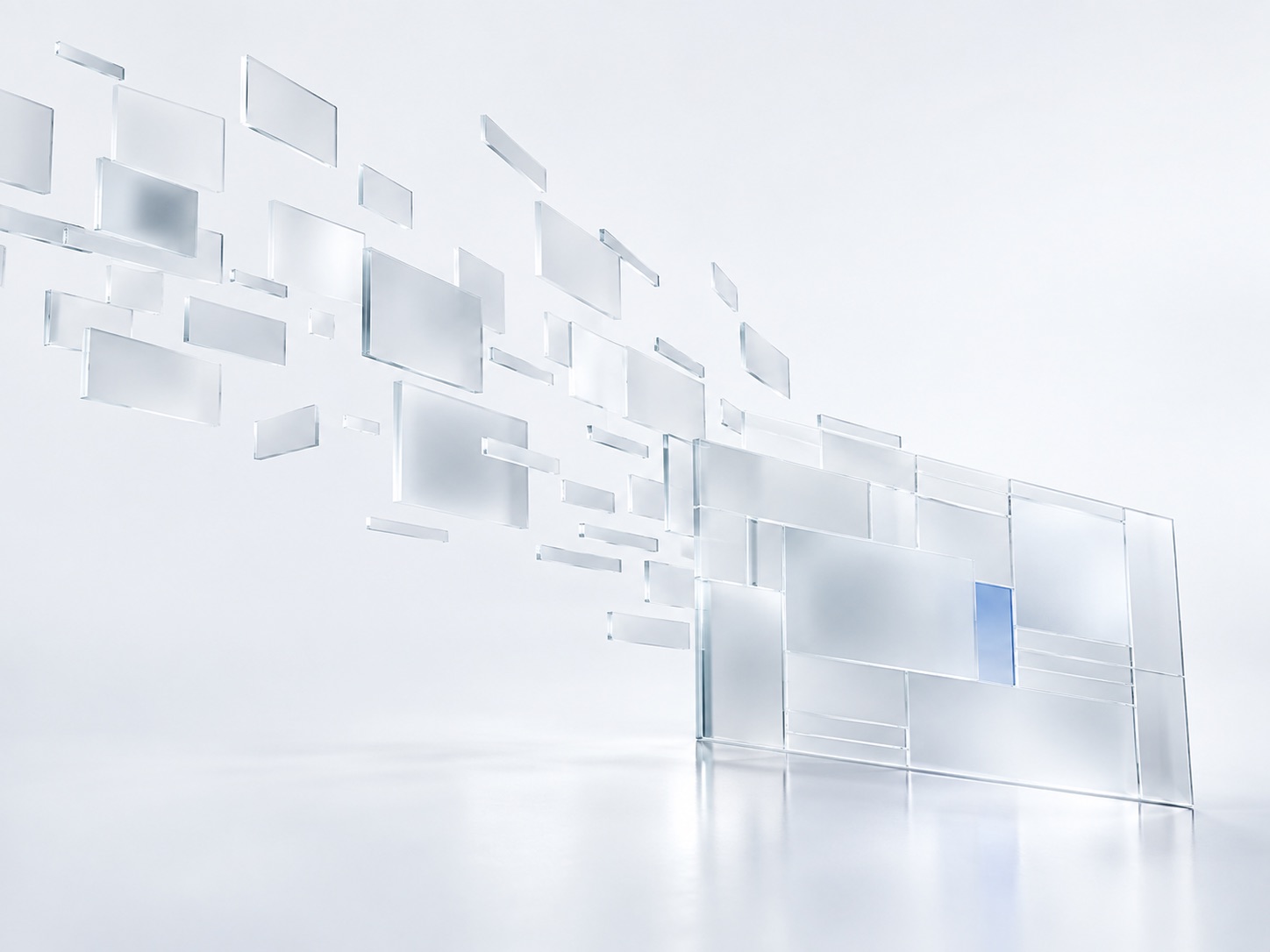 Floating glass panels assembling into a single structured wall, one pane lit blue.